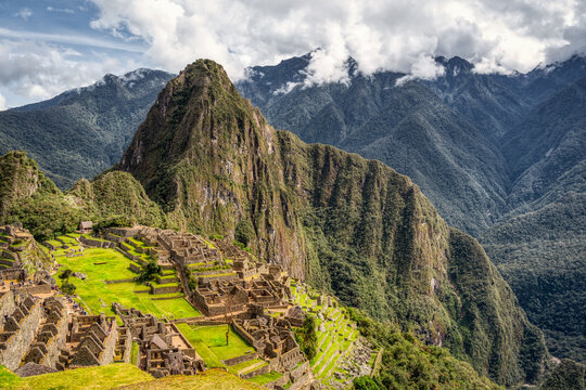 The iconic view with the Inca citadel Machu Picchu in the Andes Mountains of Peru