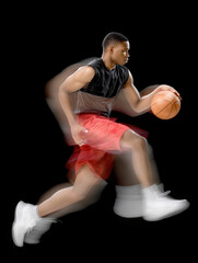 Basketball player dribbling aggressively on a court
