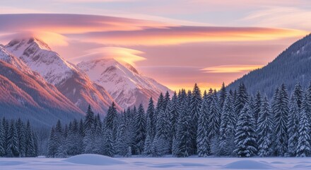Snow covered mountains and pine forest at sunset with vibrant pink and orange sky