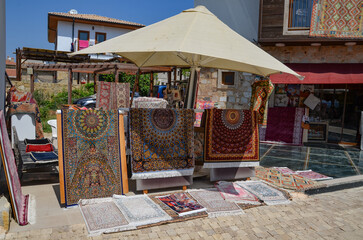 Türkiye, Side, August 25, 2025, a carpet stall on the street in Side