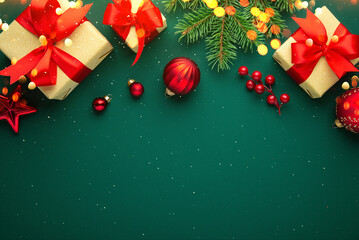 Christmas background with xmas tree, decorations, gifts, presents and sparkle bokeh lights on green...