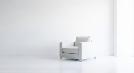 Modern white armchair with textured fabric on wooden floor in minimalist room setting.