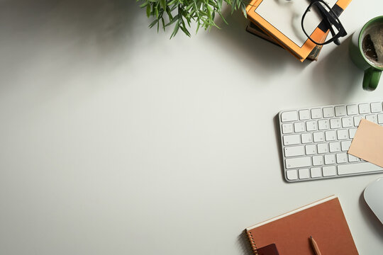 Minimalist top view workspace desk with computer, notebook, coffee