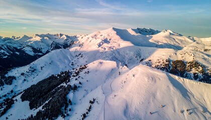 Aerial drone shot of snow-covered mountain patterns forming fractal geometry