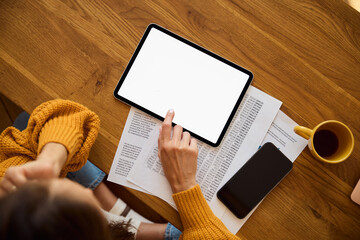 Top view mockup of young woman using blank digital tablet with empty screen