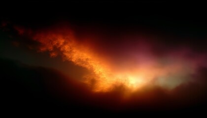 Naklejka premium A breathtaking scene of fiery clouds illuminating a dark sky, evoking a sense of mystery and drama.