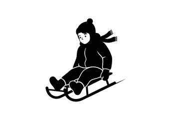 Child sledding in winter wearing warm clothing and scarf  
