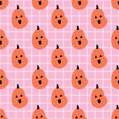 Seamless pattern with cute orange pumpkins and funny jack o lantern faces. Playful pastel Halloween design on a pink plaid background. Perfect for fabric, wrapping, and decor.
