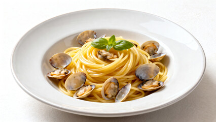A plate of pasta with clams and basil on top. The pasta is yellow and the clams are white. The dish looks delicious and appetizing