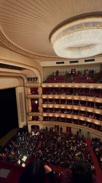 Exploring the majestic Vienna State Opera Clips showcase the opulent, gold-trimmed grand staircase, the historic exterior fa&ccedil;ade, and luxurious velvet theater boxes.
