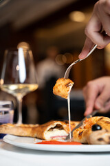 Close-Up of Calzone with Melted Cheese