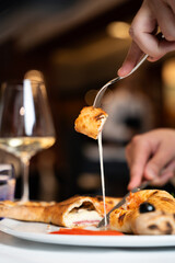 Close-Up of Calzone with Melted Cheese