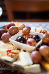 Cheese Platter with Grapes and Walnuts Close-Up
