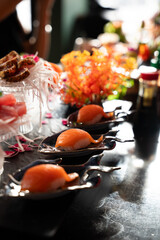 Salmon Nigiri on Black Plates