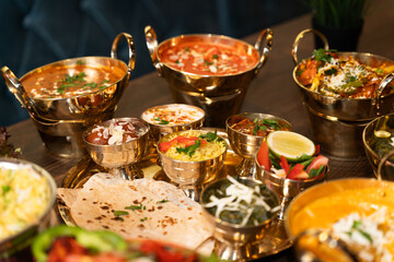 Traditional Indian thali meal with curries and bread
