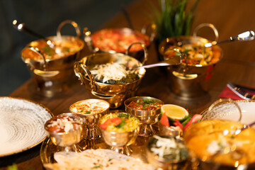 Indian Thali Set with Curry and Rice in Golden Bowls