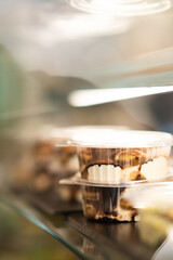 Tiramisu dessert in plastic cup in fridge display