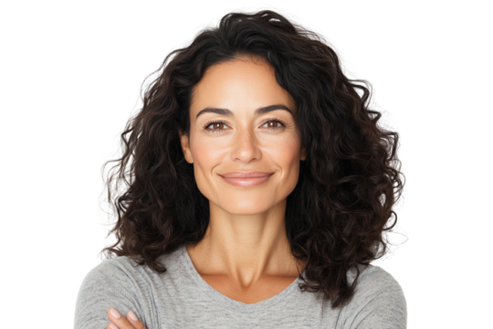 Smiling woman with curly hair crossing arms, isolated on white background.