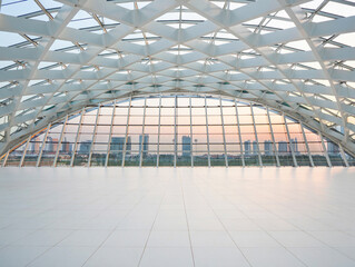 Modern architectural interior with geometric ceiling and city view