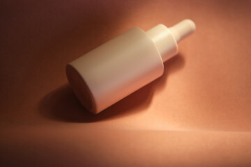 Bottles of facial serum in the soft sunset light.