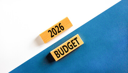 2026 Budget symbol. Concept words 2026 Budget on beautiful wooden blocks. Beautiful white and blue paper background. Business and 2026 budget concept. Copy space.