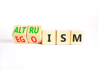 Altruism or egoism symbol. Concept words Egoism to Altruism on beautiful wooden cubes. Beautiful white table white background. Business, psychological and altruism or egoism concept. Copy space.
