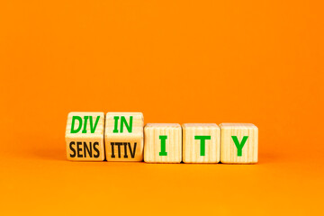Sensitivity or divinity symbol. Concept words Sensitivity or Divinity on wooden cubes. Beautiful...