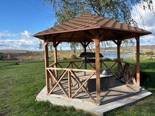 Beautiful autumn park filled with golden-yellow trees, cozy benches, and winding walking paths. Fallen leaves cover the ground, creating a peaceful and romantic atmosphere perfect for relaxation