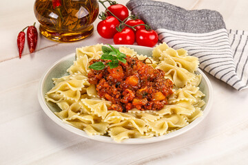 Italian pasta Farfalle Bolognese with meat