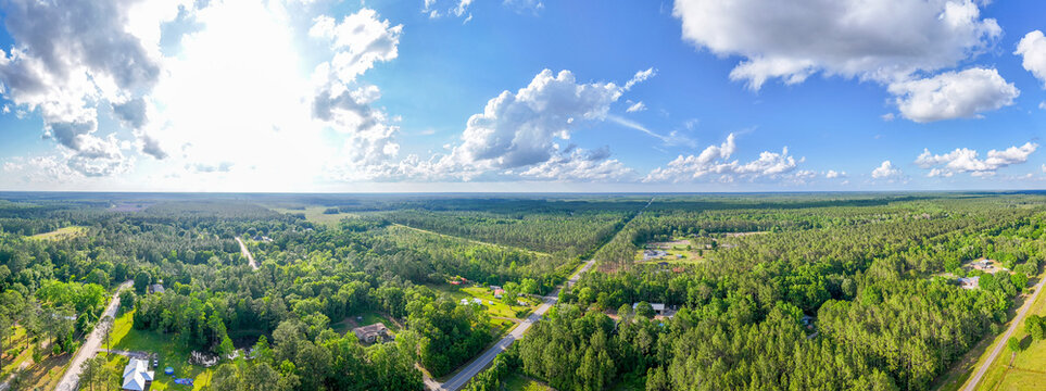 Aerial landscape of forest and pond running trail in suburban Baldwin Jacksonville Florida
