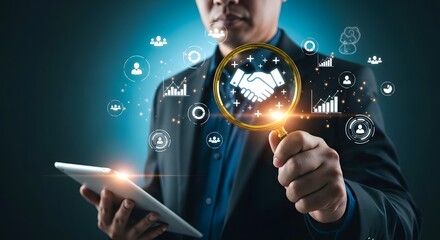 Businessman holding a tablet and magnifying glass over a handshake icon, symbolizing business partnership and digital networking