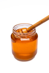 Honey jar and  honey dipper  on white background