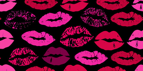 A vibrant seamless pattern of lipstick kiss marks in various shades of pink and red against a black background
