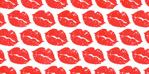 Seamless pattern of red lipstick kiss marks on a white background