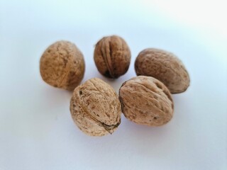 Walnuts. Walnuts in their shells.
