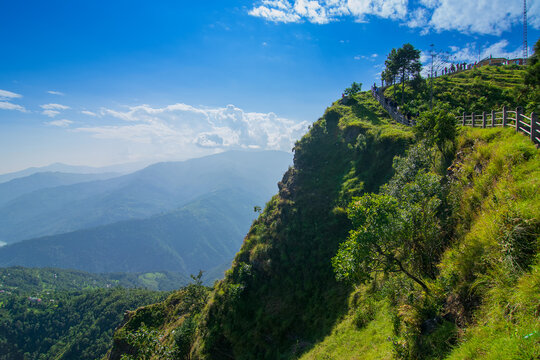 View of Himalayan mountain, blue sky and forest from Tarey Bhir point, tourist spot, Sikkim, India. 'Bhir' means cliff in the local language,about 10,000 feet long path, breathtaking view at the edge.