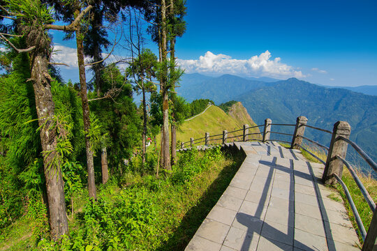 Stair case from foreground towards Himalayan mountains in horizon, Tarey Bhir point, famous tourist spot, Sikkim, India. The word 'Bhir' means cliff in the local Nepal language,long path for tourists.