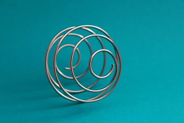 Metal spiral that forms a sphere