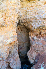 Ponta da Piedade near Lagos in Algarve, Portugal. Tourist boats and cliff rocks in the Atlantic Ocean at Ponta da Piedade, Algarve region, Portugal.