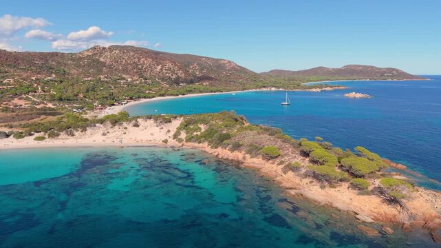 sunny corsican scenic panorama, serene turquoise waters with lush pinecovered headlands visible. France