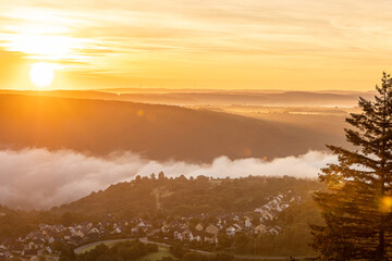Captivating sunrise over the Rhine River near Bad Salzig in Germany with misty landscapes and serene horizons