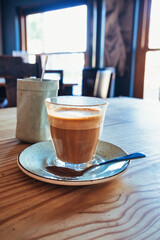 Latte in Glass with Soft Caf&eacute; Lighting