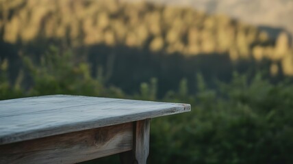 Fototapeta premium Empty wooden table with blurred forest background for product display montage