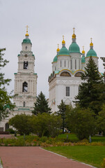 View of the Astrakhan Kremlin with the Assumption Cathedral and the bell tower on a cloudy day. Astrakhan, Russia