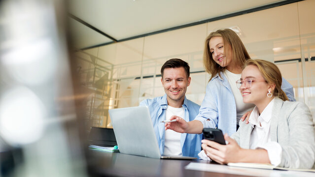 Team collaboration in a modern office during a brainstorming session with technology