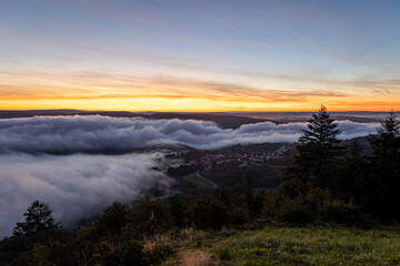 Sunrise over the Rhine River near Bad Salzig in Germany creates a breathtaking view with fog and colorful skies
