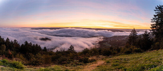 Stunning sunrise over the Rhine River near Bad Salzig, Germany creating a magical cloudscape