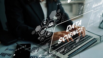 Professional working on data science project with digital interface and graphs on laptop in modern office environment. Asymptotic smart data analytic.