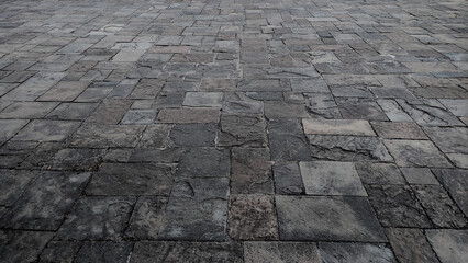 Old stone pavement medieval style with texture on the tiles 