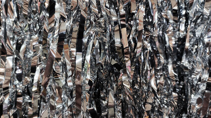 Closeup of silver shining decoration hangings with dark and light shades of grey